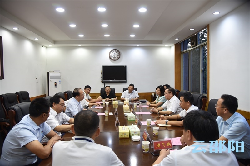 龚文密会见华中科技大学教授尹周平一行