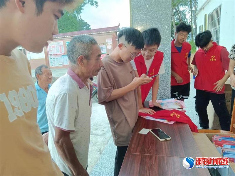 【新时代文明实践】洞口县石江镇白羊村举行乡贤捐赠头盔暨拆伞戴帽仪式